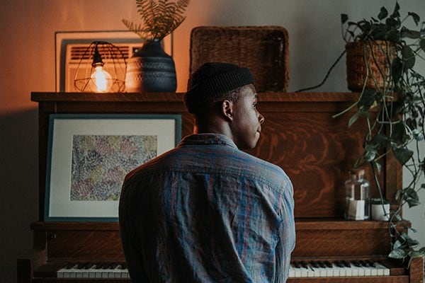 Sperm donor playing on an old piano