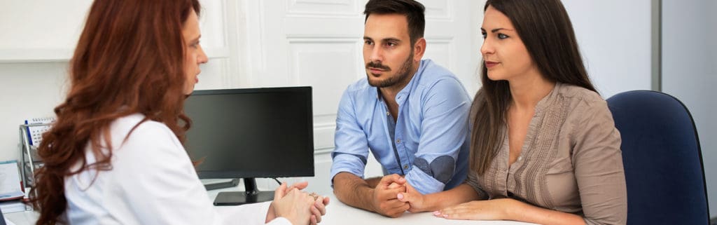 A couple talking to a doctor