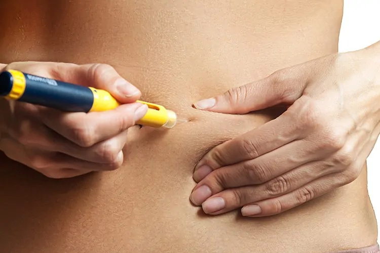 A woman taking hormones as part of an egg freezing programme