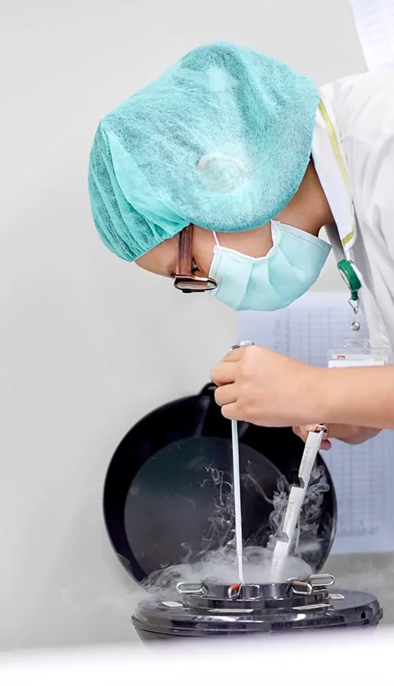 A laboratory scientist freezing eggs or embryos