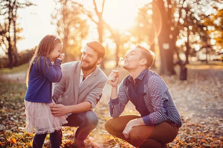 A homosexual couple with their daughter who is conceived via a surrogate