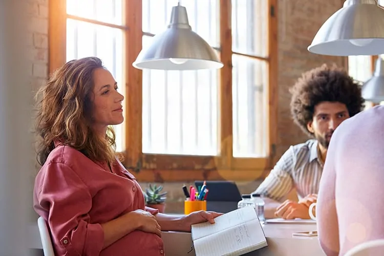 A surrogate talking to the parents to be