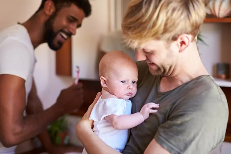 A homosexual couple in the US with their adopted baby