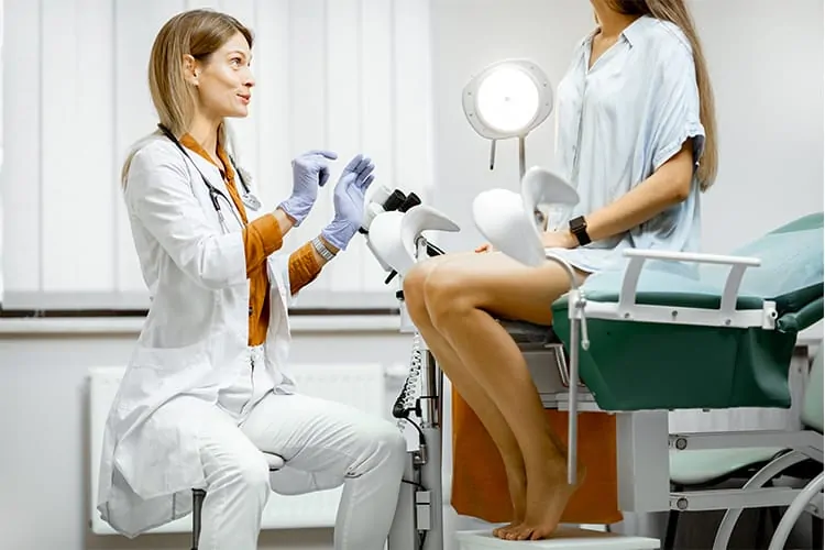 Doctor and woman talking before an egg retrieval procedure