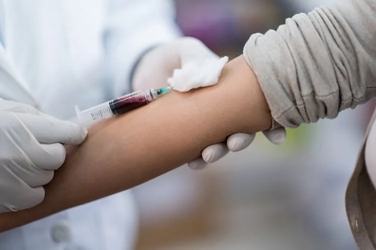 Woman getting a blood test taken to access hormone levels