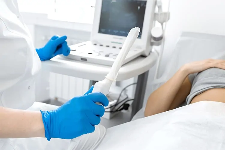 Woman having transvaginal ultrasound