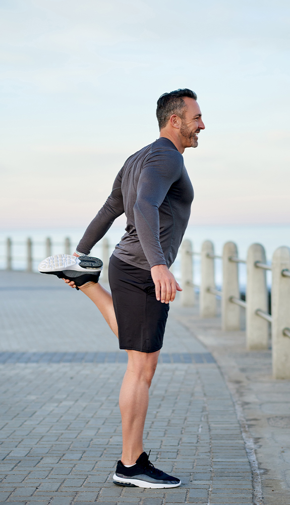 Man stretching after running